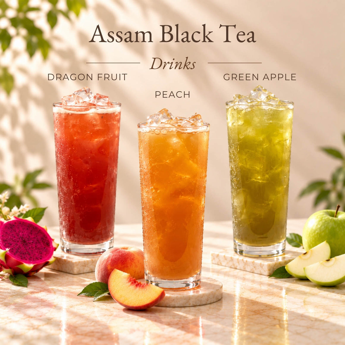 Three iced Assam black tea drinks flavoured with dragon fruit, peach and green apple syrups, served in tall glasses with ice.