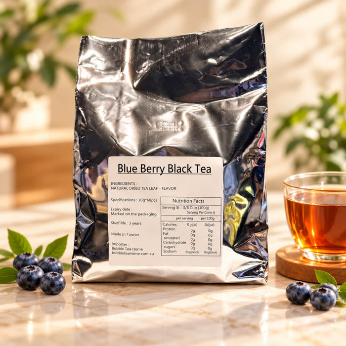 Blueberry Black Tea in a silver foil package containing 60 tea bags of 10g each, displayed alongside fresh blueberries and a glass cup of brewed black tea.