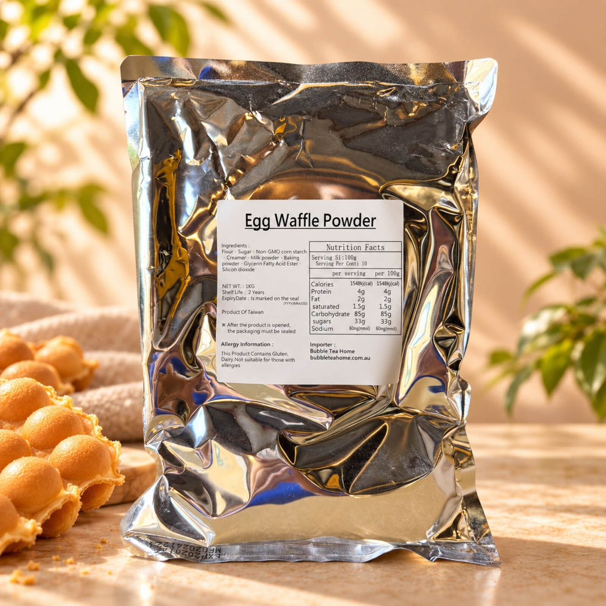 Bubble Waffle Powder in a 1kg silver foil package labelled Egg Waffle Powder, displayed with golden bubble waffles on a warm beige background.