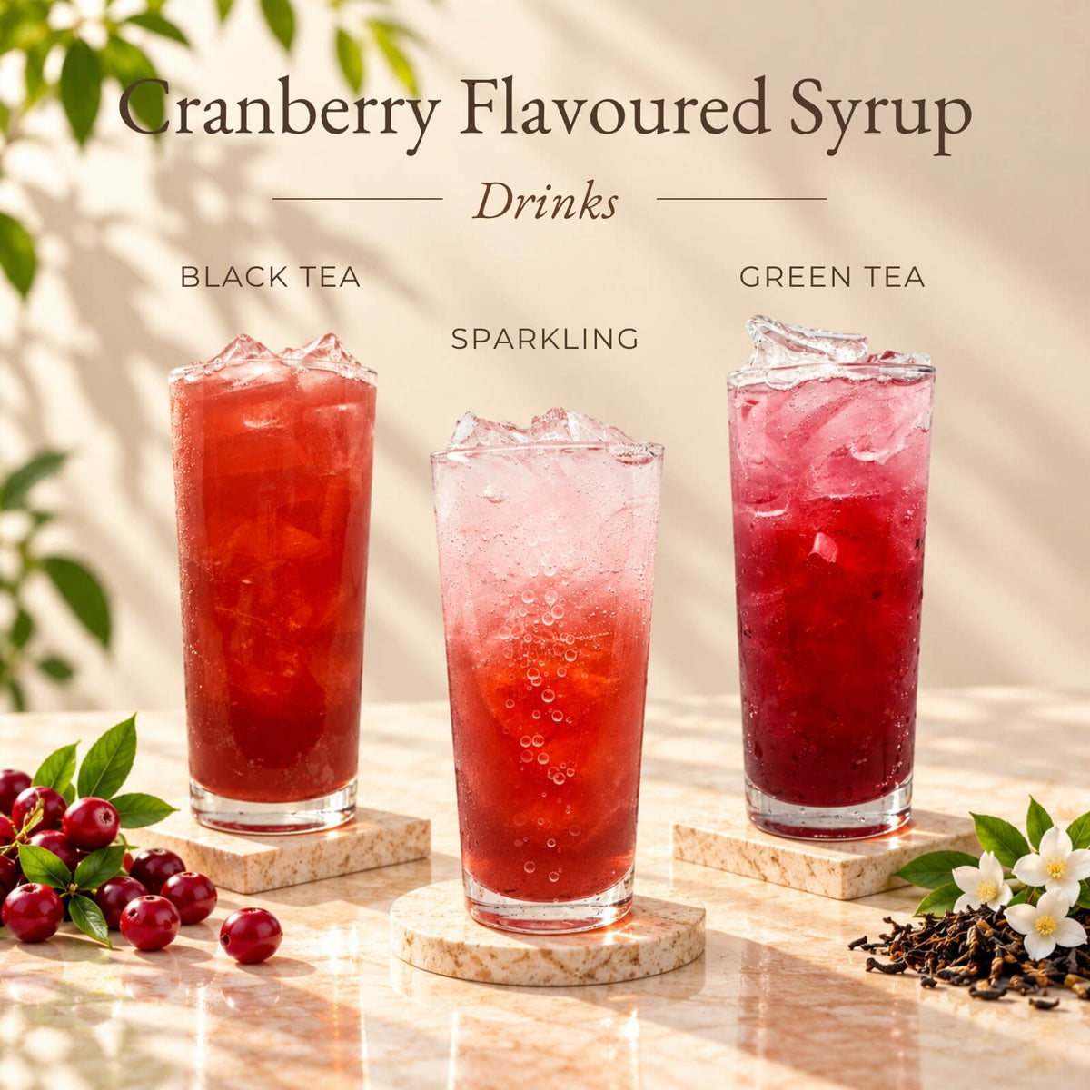 Three iced drinks made with cranberry flavoured syrup, featuring cranberry black tea, sparkling drink and green tea.