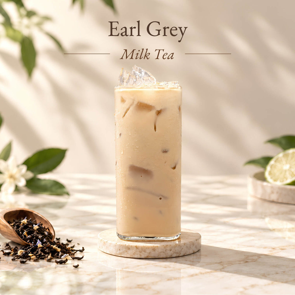 Iced Earl Grey milk tea made with Earl Grey black tea, served in a tall glass with ice and displayed alongside loose tea leaves.