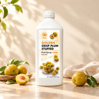 2.5kg white bottle of Golden Crispy Plum Syrup with an orange fruit label, displayed alongside whole and halved golden plums.