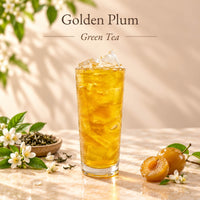 Iced golden plum green tea made with Golden Crispy Plum Syrup, served in a tall glass with ice and displayed alongside golden plums.