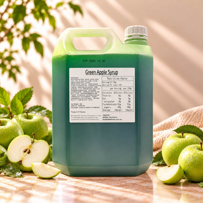 5kg container of Green Apple Flavoured Syrup with dark green syrup, a white screw cap and product label, displayed alongside fresh green apples and slices.