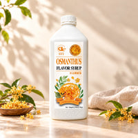 2.5kg white bottle of Osmanthus Flavoured Syrup with an orange floral label, displayed alongside yellow osmanthus blossoms.
