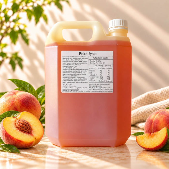 Peach flavoured syrup in a 5kg bottle, displayed with fresh peaches.