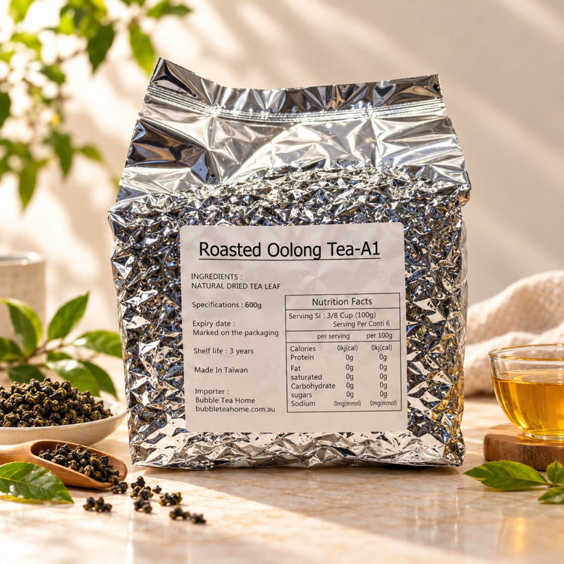 600g package of Roasted Oolong Tea in a silver foil bag with a product label, displayed alongside rolled oolong tea leaves and a cup of golden brewed tea.