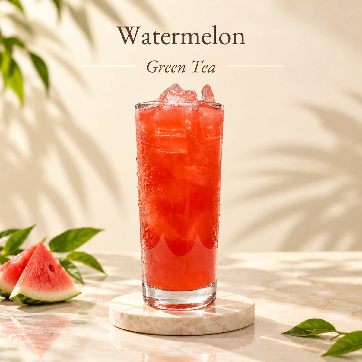 Iced watermelon green tea made with watermelon flavoured syrup, served in a tall glass with ice and displayed alongside fresh watermelon slices.