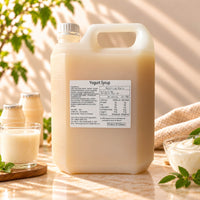 5kg container of Yoghurt Flavoured Syrup with a creamy beige appearance, displayed alongside yoghurt drinks and a bowl of yoghurt.