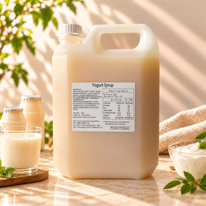 5kg container of Yoghurt Flavoured Syrup with a creamy beige appearance, displayed alongside yoghurt drinks and a bowl of yoghurt.