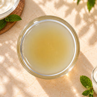 Yoghurt flavoured syrup in a glass bowl, showing its pale creamy-yellow colour and smooth texture.